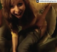 A girl takes a record-breaking, long piss as her friends observe while laughing.